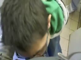 5 guys playing in a public toilet